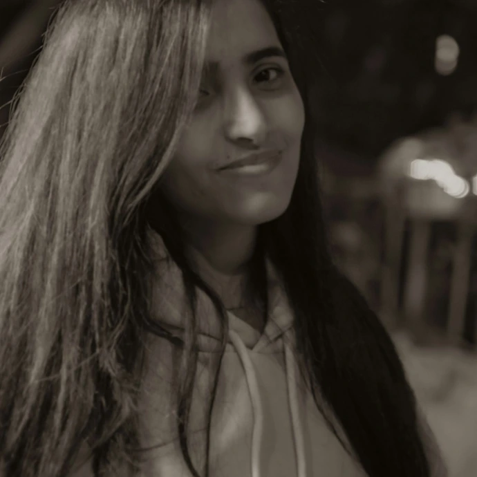 a woman with long hair is posing for a picture