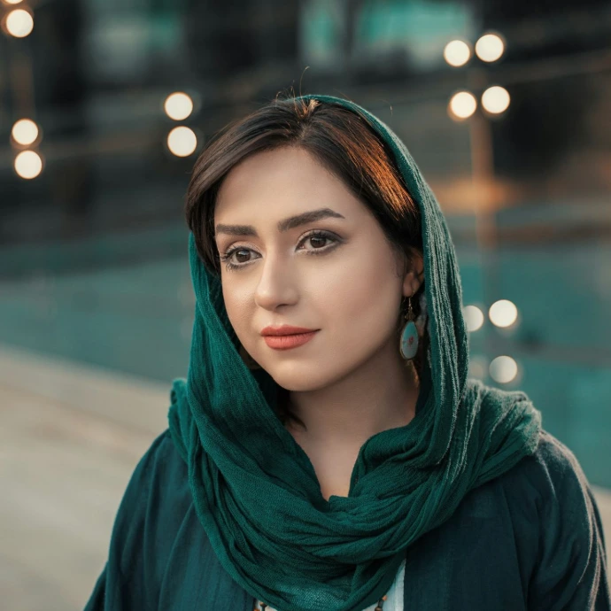 woman wearing green hijab headscarf standing